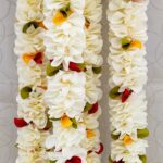 Pair of White Petal Garlands with Green-Mustard-Red Pineapple Cut Bunches