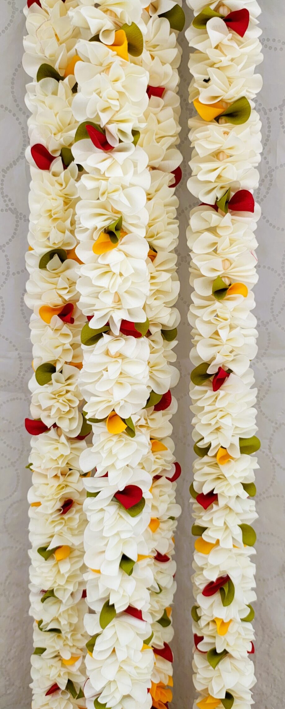Pair of White Petal Garlands with Green-Mustard-Red Pineapple Cut Bunches